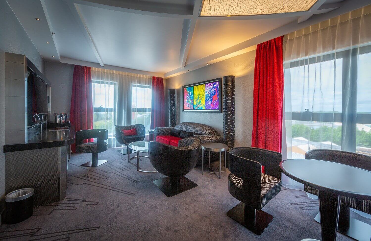 Spider-Man Suite living area Glance into the living area of the suite, large pictures of Spider-Man hang over the couch