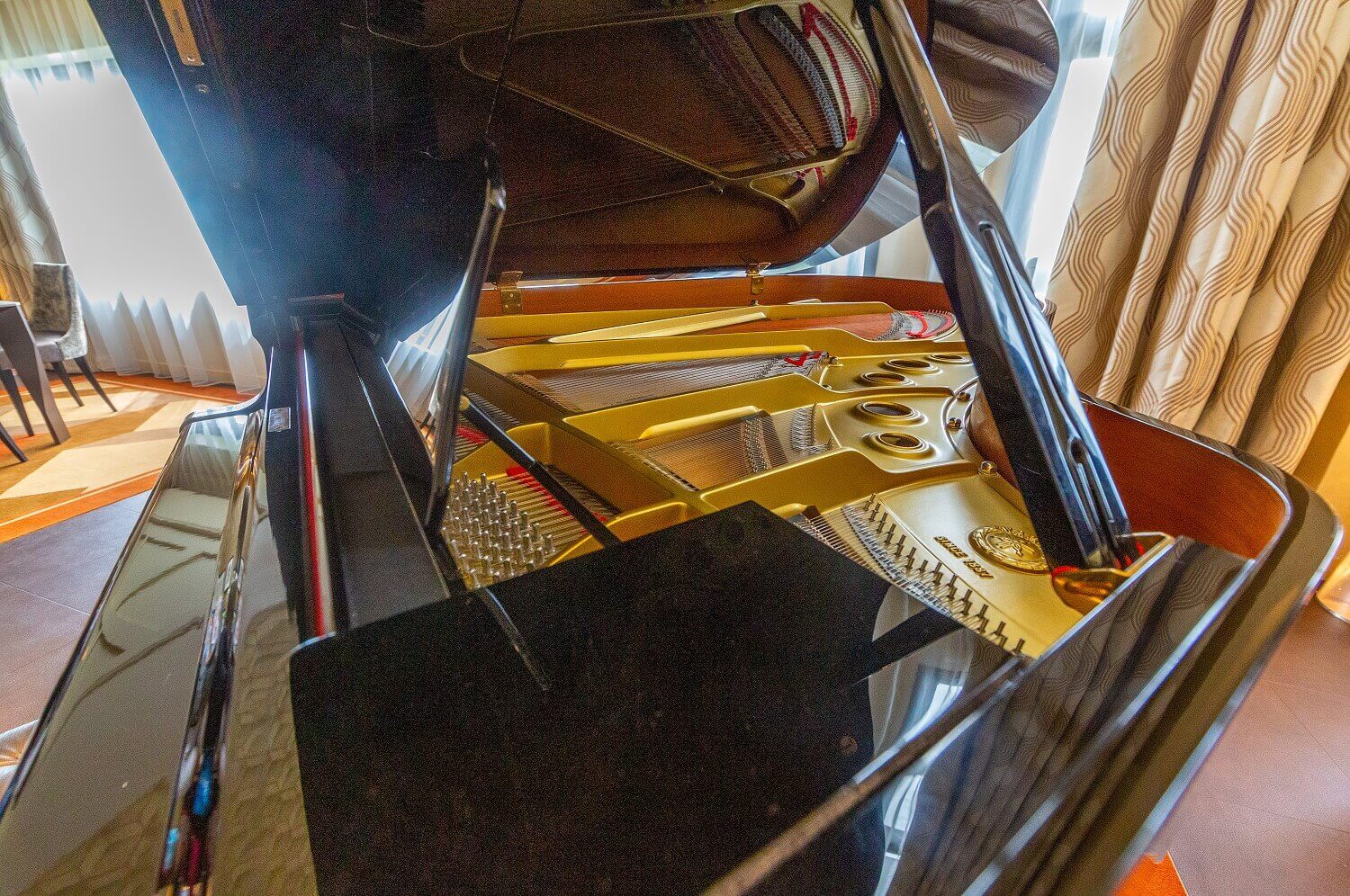 Piano in the presidential suite Close up of the open piano in the suite