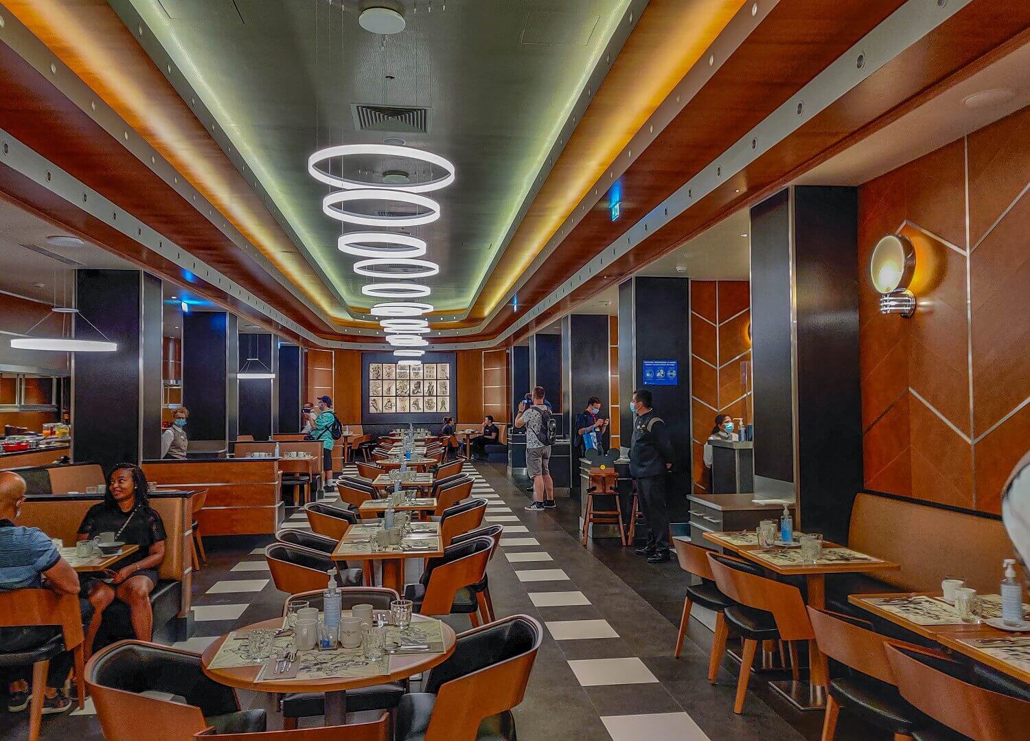 Downtown Restaurant In the middle of the restaurant is a long row of individual tables.