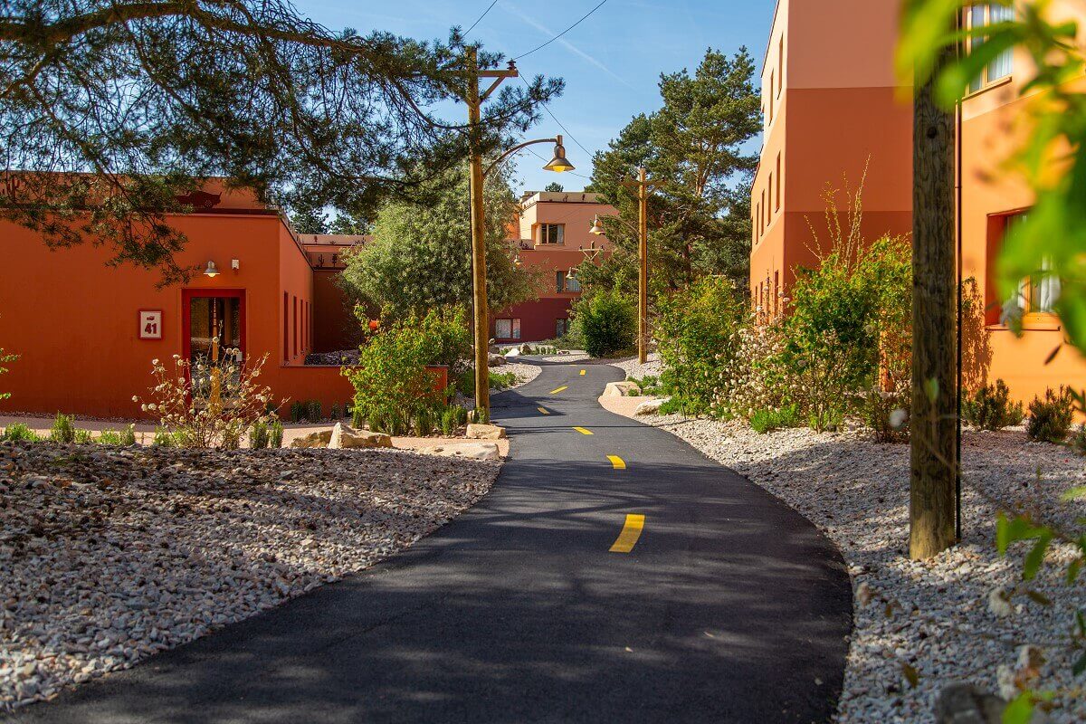 Santa Fe Hotel Building with Route 66 Route 66 winds through the Mexican-style landscape with hotel buildings.