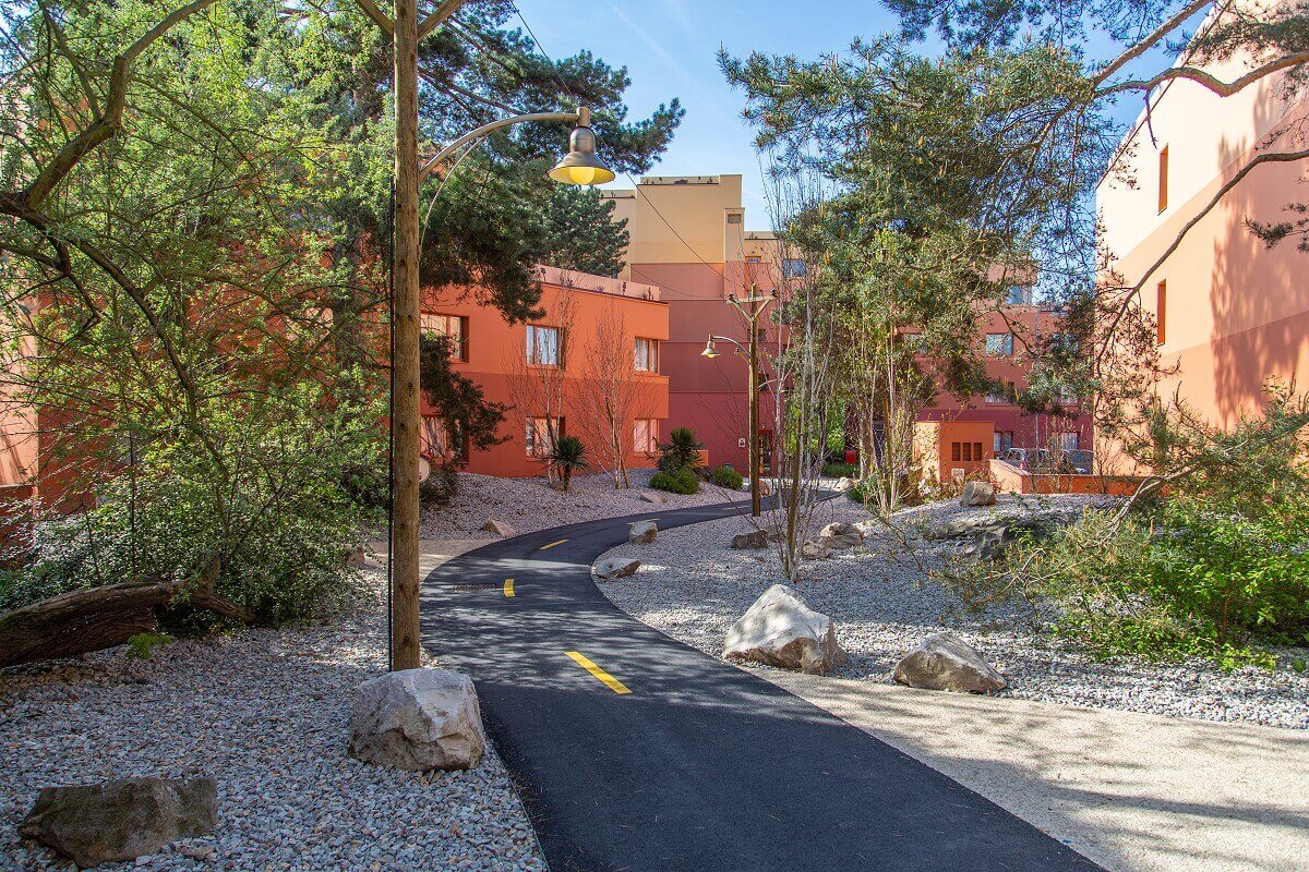 Santa Fe Hotel Building with Route 66 Route 66 winds through the Mexican-style landscape with hotel buildings.
