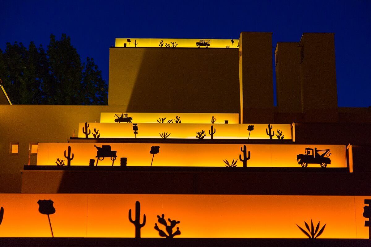 Hotel building Santa Fe by night A hotel building illuminated at night. On the roofs are illuminated borders with motifs from the movie Cars.