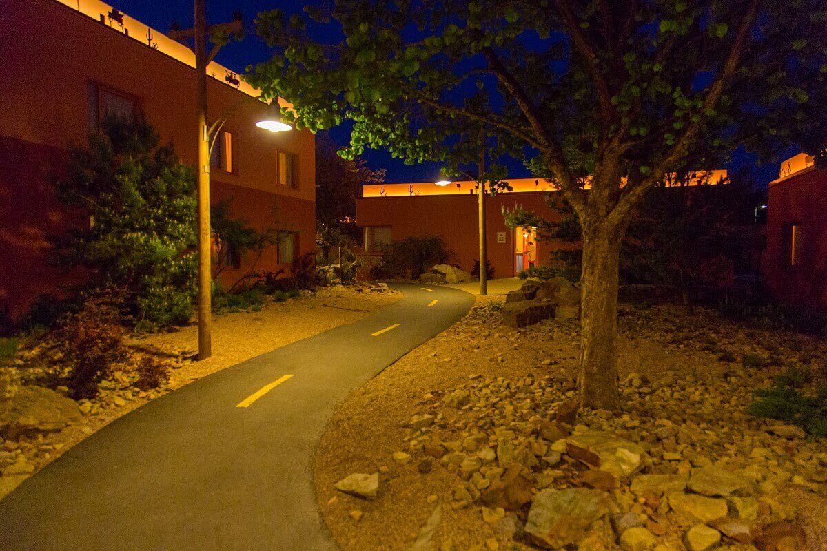 Hotel building Santa Fe by night Two streetlights illuminate Route 66 at night.