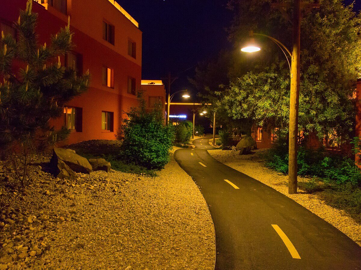 Hotel building Santa Fe at night with Route 66 Route 66 winds through the Mexican-looking landscape of hotel buildings at night.