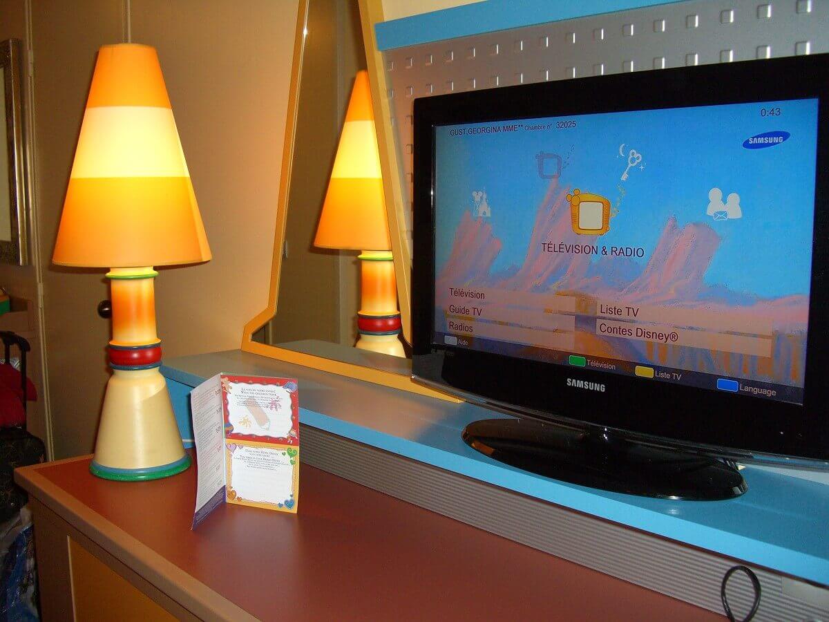 TV set and lamp in the hotel room A TV set in the hotel room, next to it is an orangish lamp