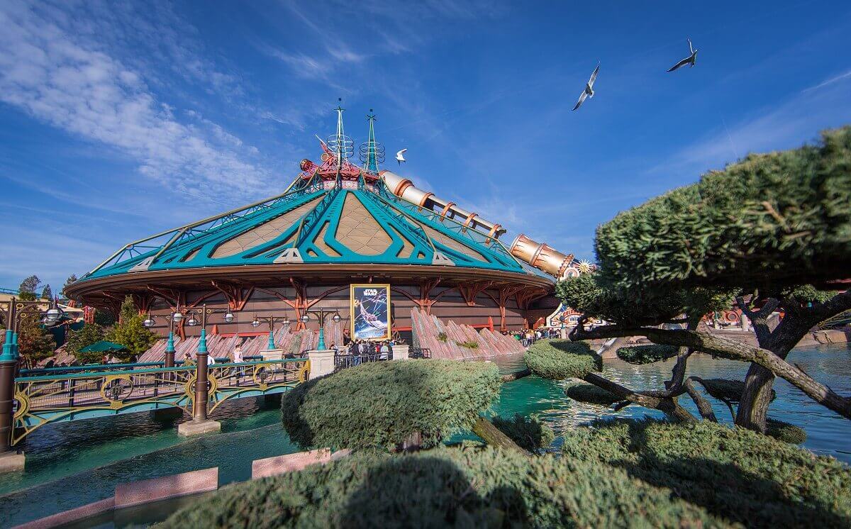 Futuristic building View past green areas and a small body of water to the dome of Hyperspace Mountain