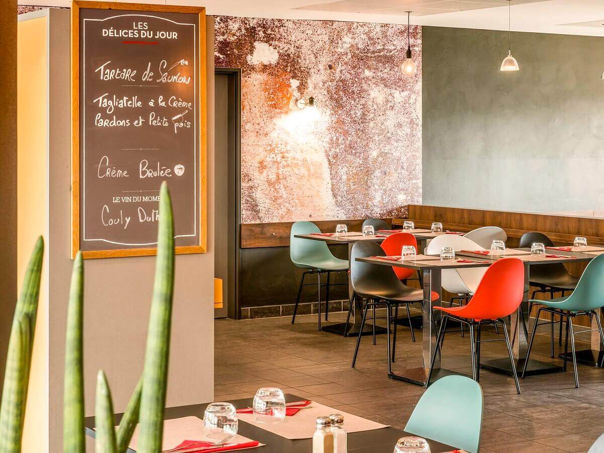 Hotel restaurant View into the hotel restaurant with a blackboard on which daily dishes are recommended