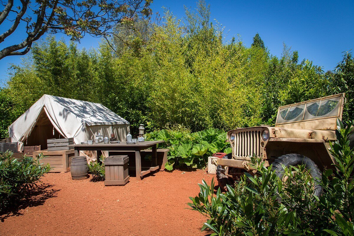 holding area View of an abandoned camp with tent, table and truck in the queue area of the Indiana Jones roller coaster