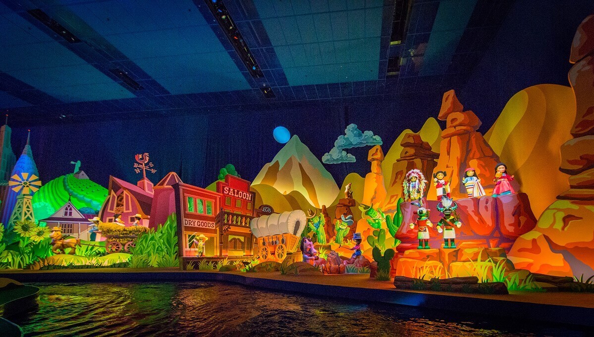 Wild West at Its a small world in a diorama of the attraction Its a small world dolls are dressed up as indigenous people and as cowboys