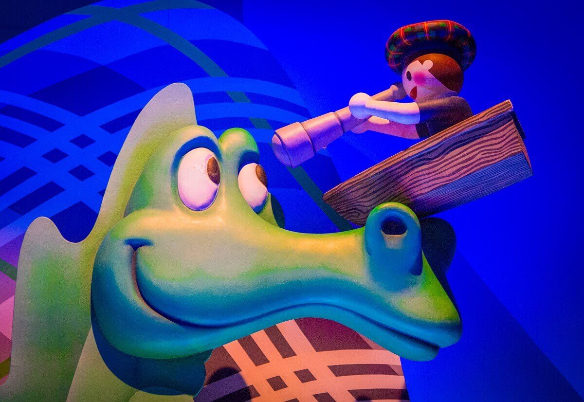 Nessie the monster of Loch Ness looks friendly in the direction of a curious observer at Its a small world