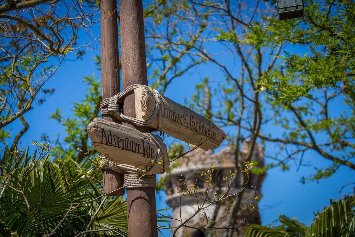 Signpost in Adventureland a signpost shows the way to the Pirates of the Caribbean and the Adventure Isle