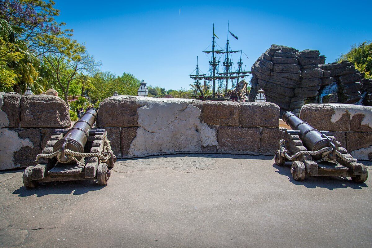 two guns on one wall two large cannons are set up against a wall and pointed in the direction of Captain Hook's ship