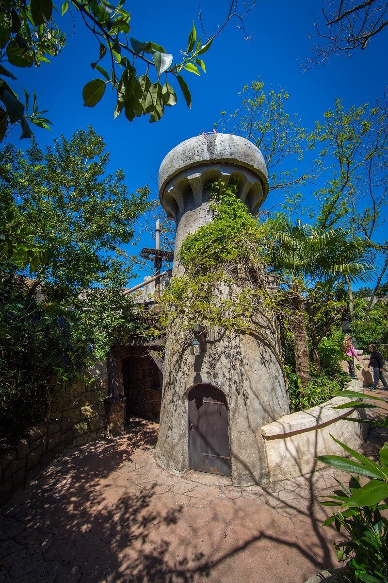 small round tower a small round tower overgrown by plants near the Pirates of the Caribbean