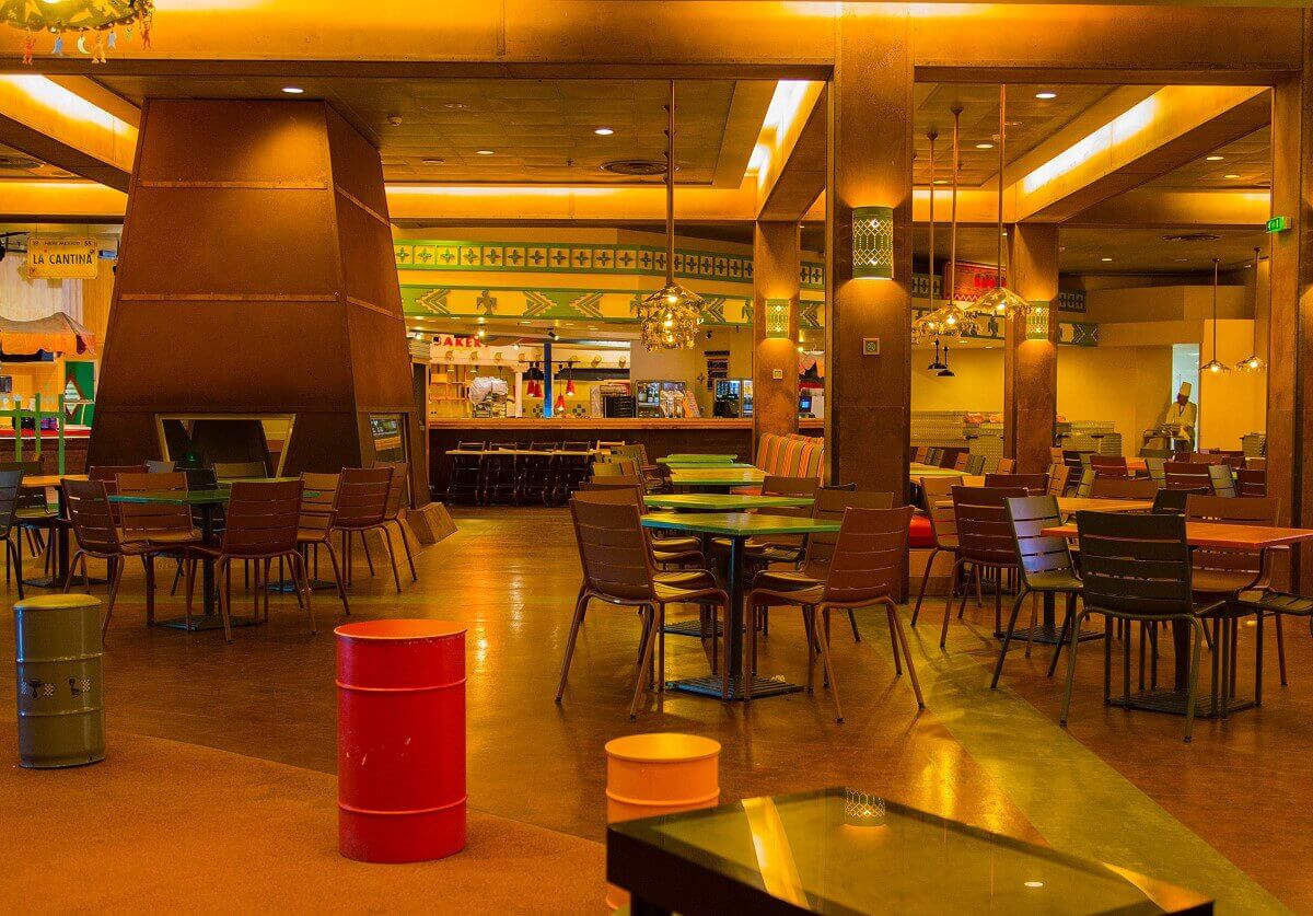 Dining area La Cantina The illuminated dining room with many colorful benches, tables and chairs