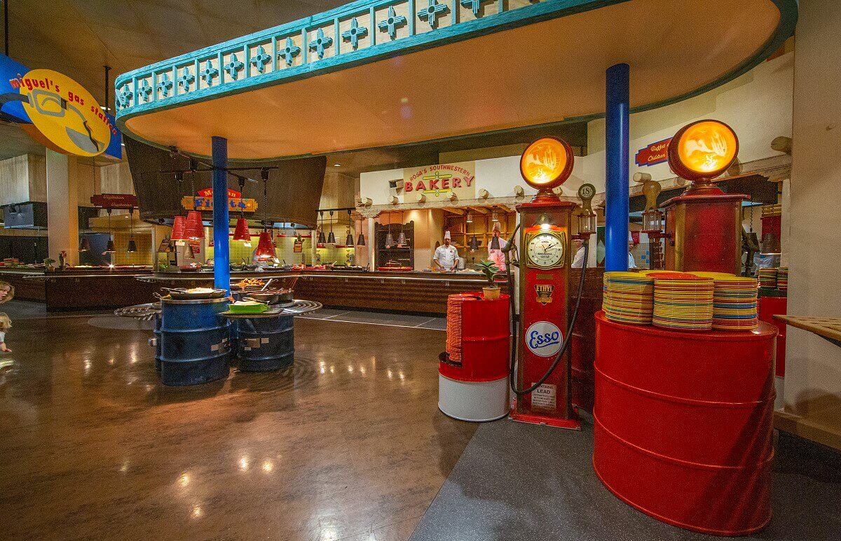 Buffet area at La Cantina The buffet area decorated with many decorative elements on the theme of cars, in the background you can see two cooks at the counter