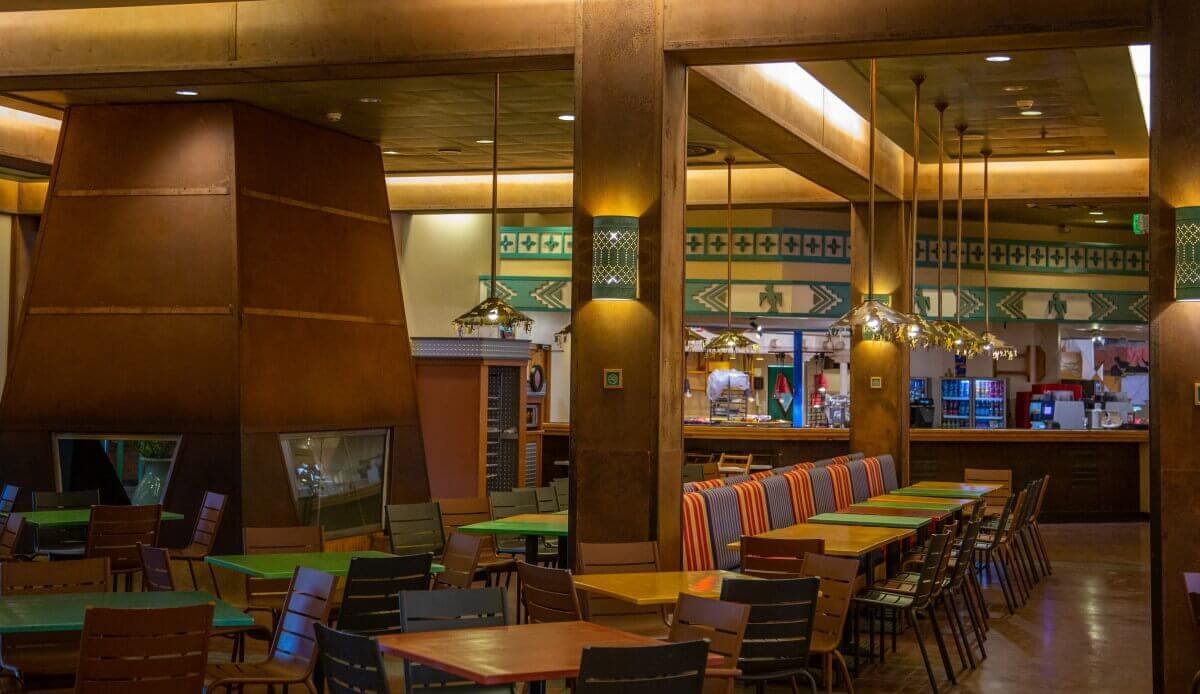 Dining room La Cantina View into the dining room with many colourful benches, tables and chairs