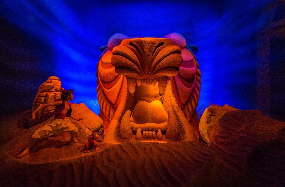 The entrance to the miracle cave Aladdin and Abu stand in front of the entrance to the Cave of Wonders in the desert