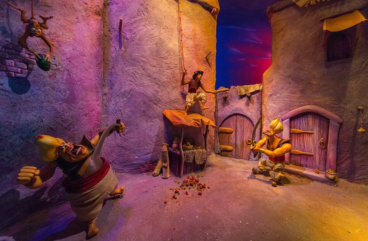 Aladdin escapes from the soldiers In this scene you see Aladdin and Abu escaping from the soldiers at the marketplace of Agrabah.