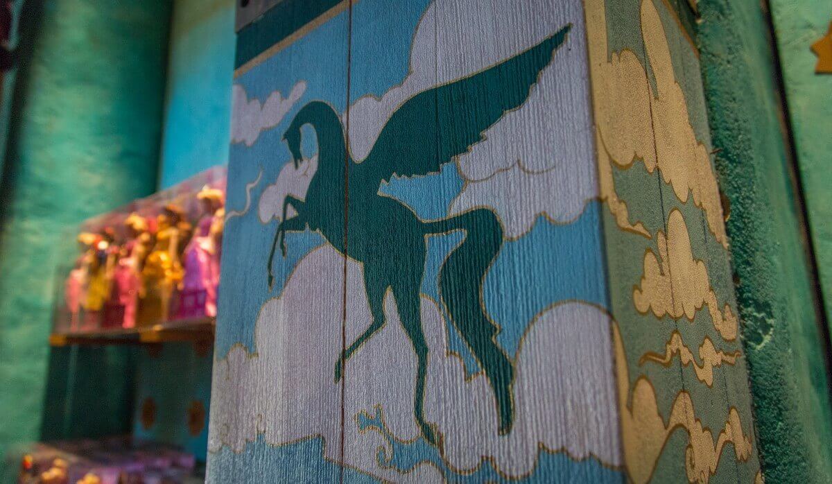 Pegasus drawing on a wooden door Pictorial representation of a winged horse creature on a wooden door in the shop