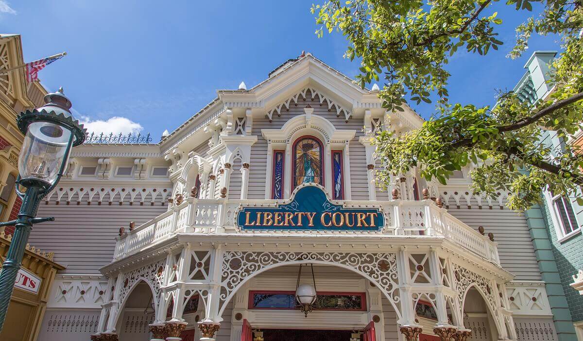 Upper part of the entrance of the Liberty Court Upper part of the entrance of Liberty Court with a stained glass window showing the Statue of Liberty