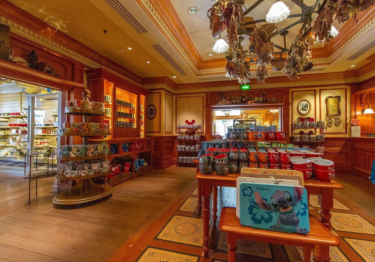 Salesroom in Lilly's Boutique The salesroom in Lilly's Boutique is decorated in warm brown tones. On display are mainly cups and other tableware on the shelves and tables