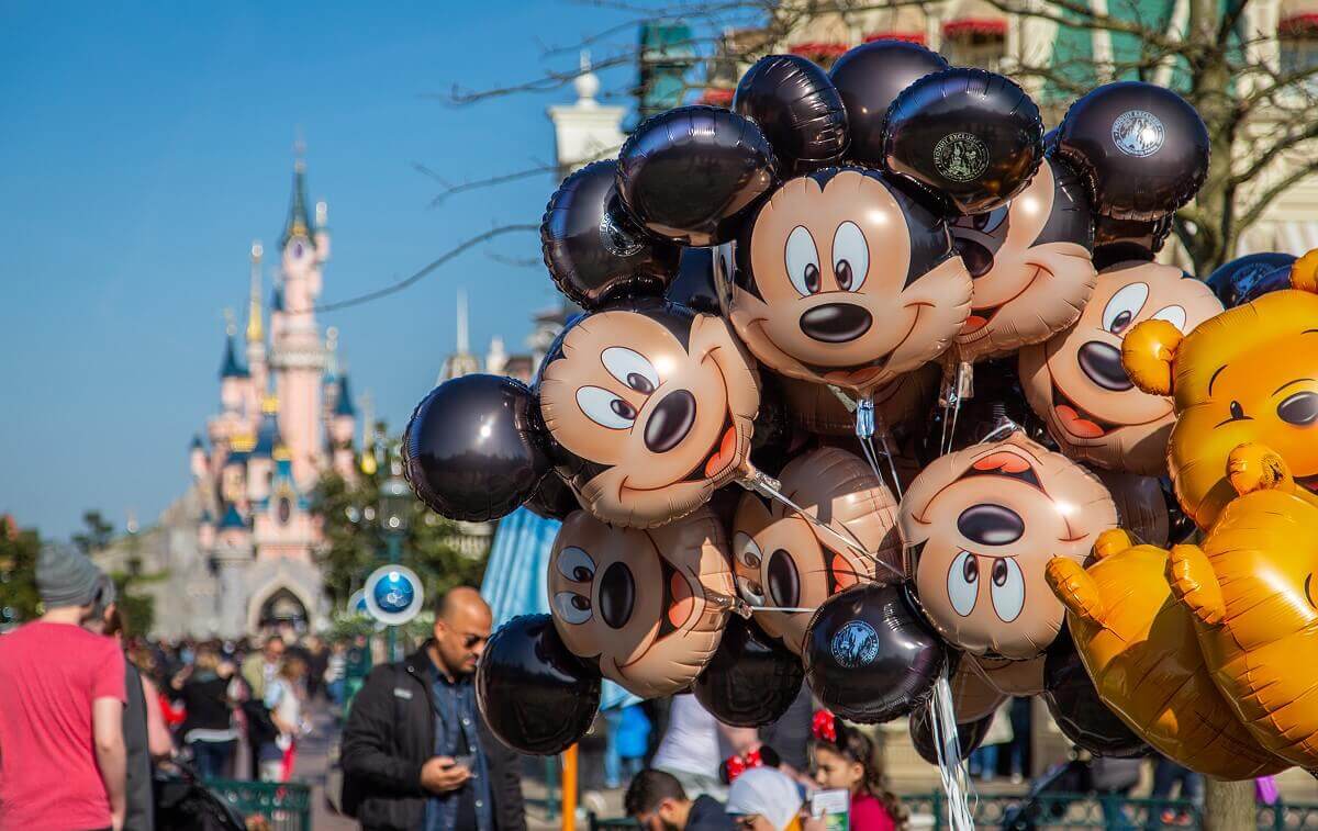 Mickey Mouse Balloons A cluster of Mickey Mouse balloons flies on Main Street, U.S.A., with Sleeping Beauty Castle in the background