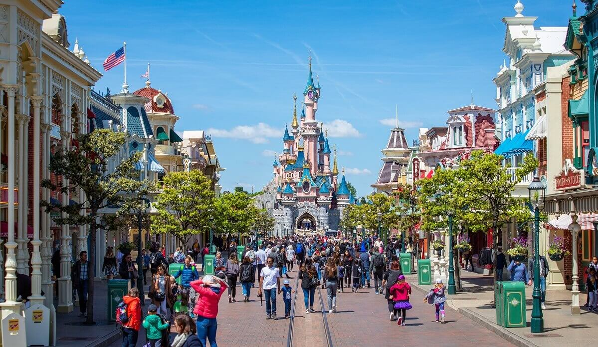 Main Street U.S.A. with Sleeping Beauty Castle at the far end Main Street U.S.A. is heading toward Sleeping Beauty Castle, which is framed by the Main Street buildings on the right and left in this photo