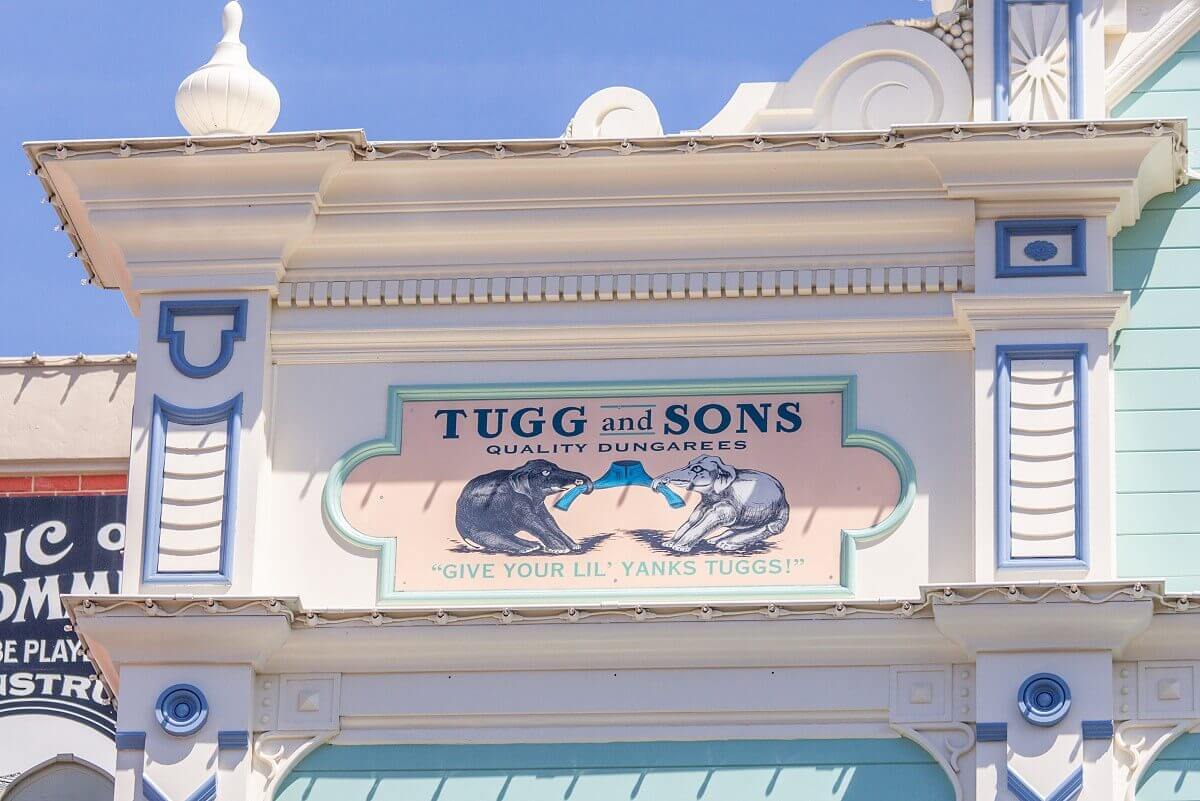 Tugg and Sons Advertising Tugg and Sons advert with two elephants tearing at a pair of trousers: Tugg ansd Sons Quality Dungarees 'Give your lil' Yanks Tuggs!'