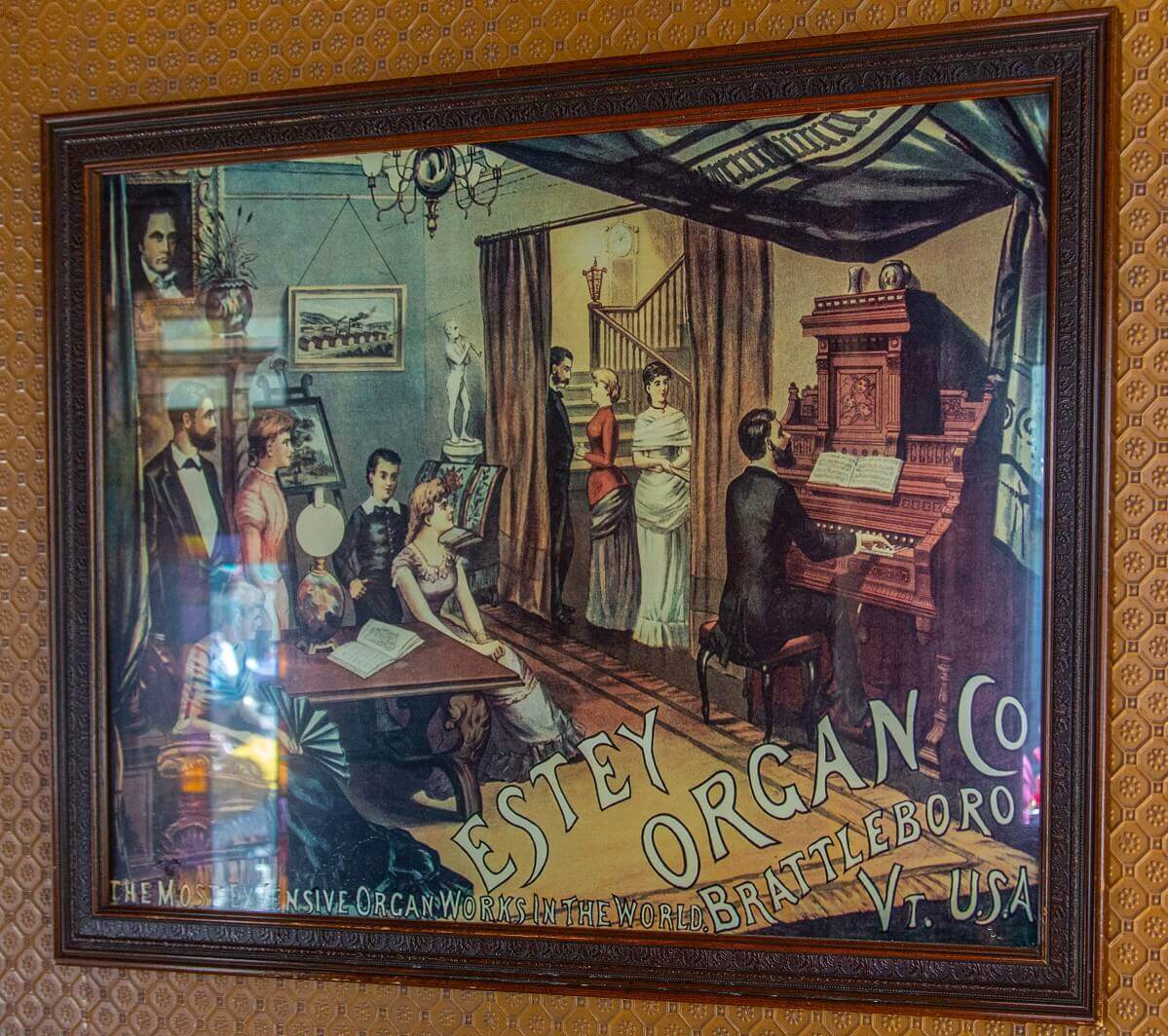 Mural of a stately salon Mural of a stately drawing room: several gentlemen and ladies listening to an organ player. Historical advertisement for Estey Organ Company