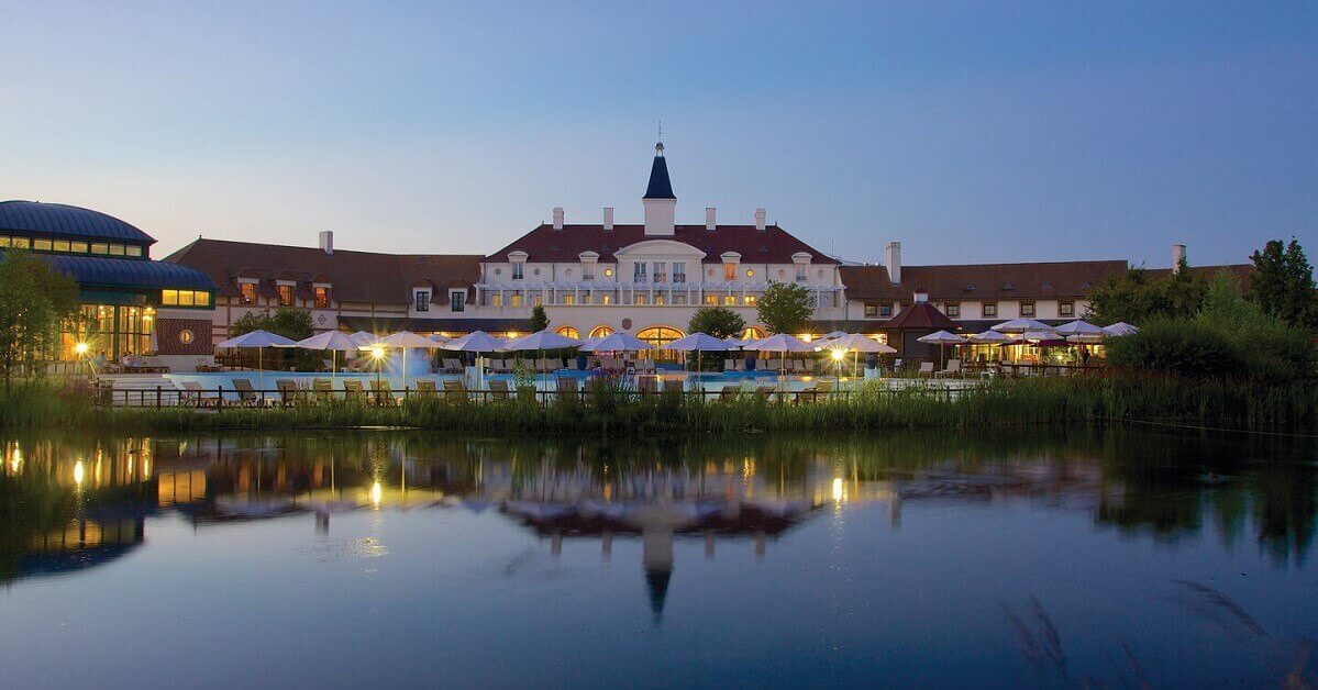 Marriott Village Disneyland Paris The main house of the Marriott Village seen across the lake at night