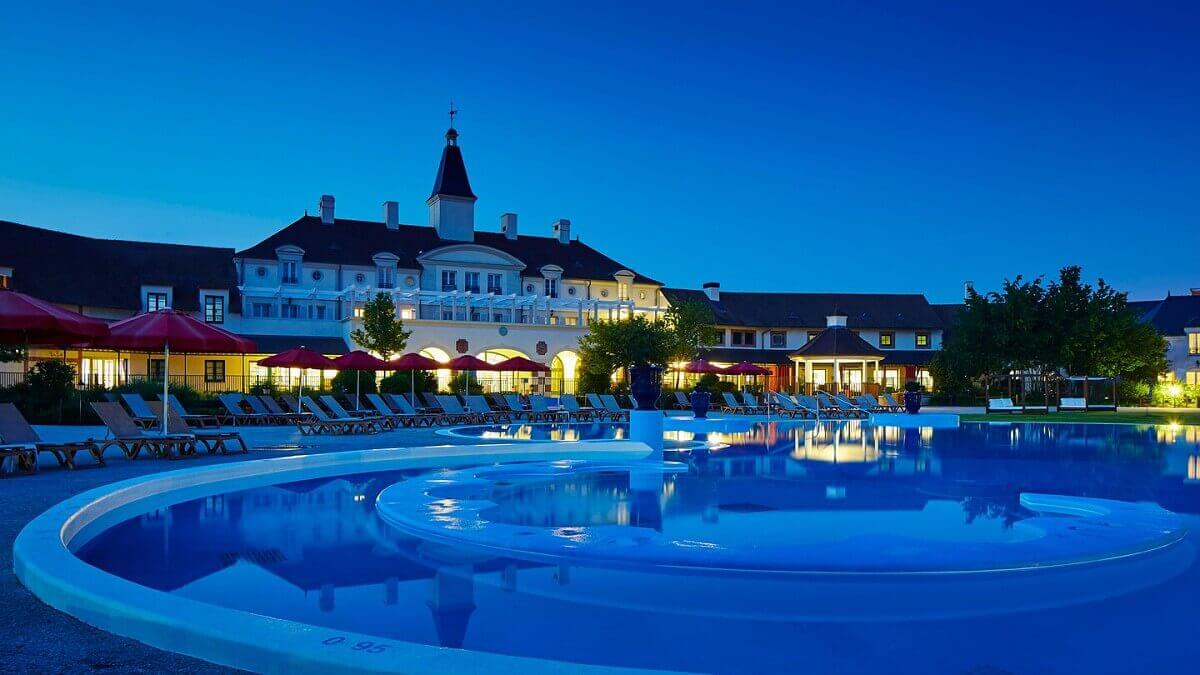 Pool in the dark View of the abandoned pool at dark in front of the main building of the Marriott Village Hotel