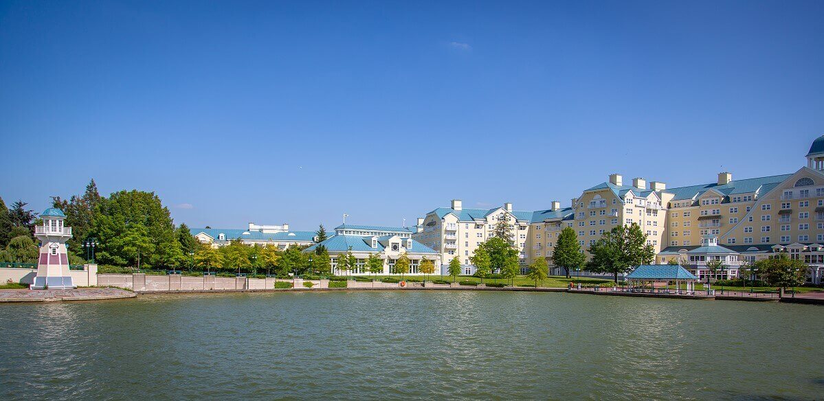 Hotel Newport Bay Club View over Lake Disney to the hotel building. At the left edge of the picture is the small lighthouse.