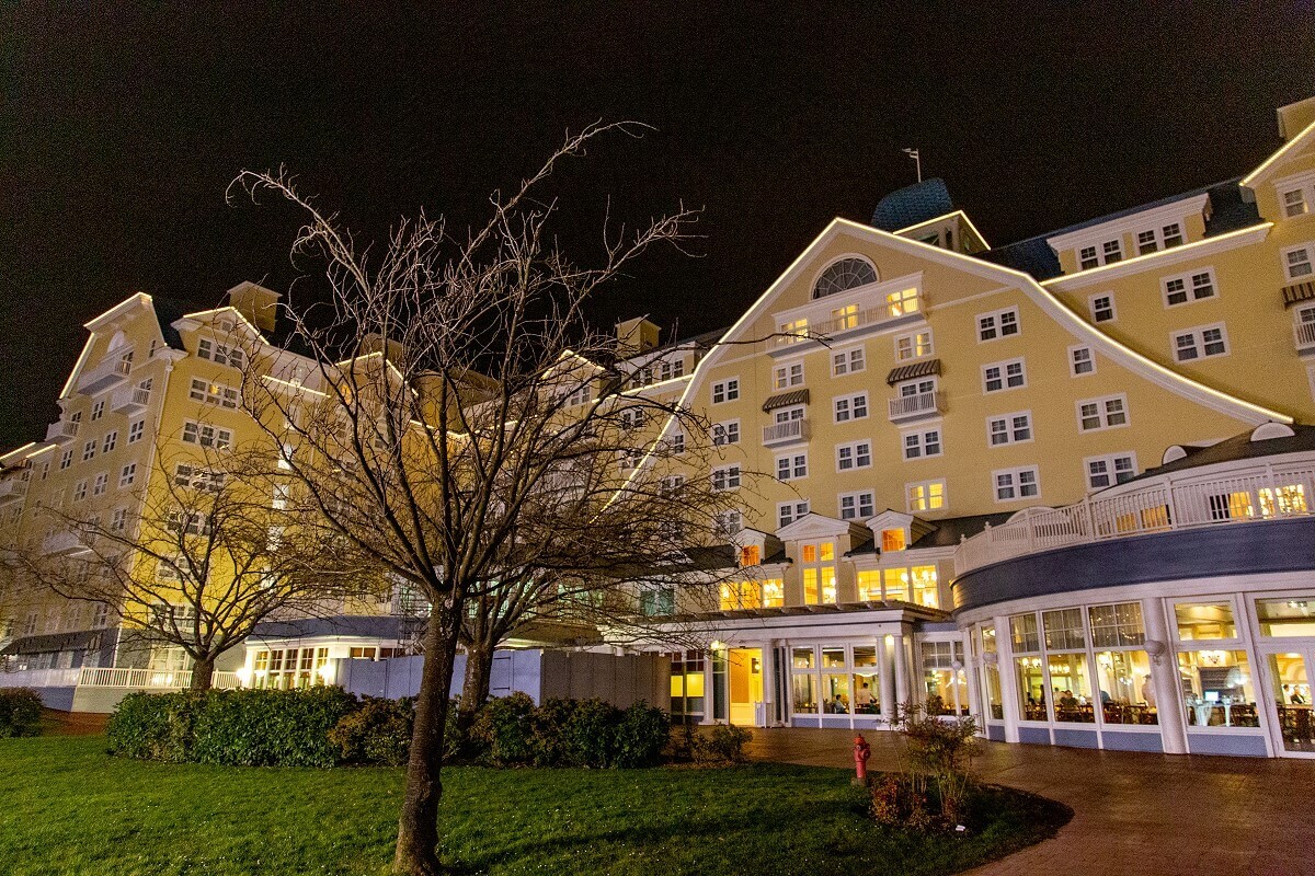 Hotel Newport Bay Club The illuminated exterior of the Hotel Newport Bay Club at night. A tree is in the foreground.
