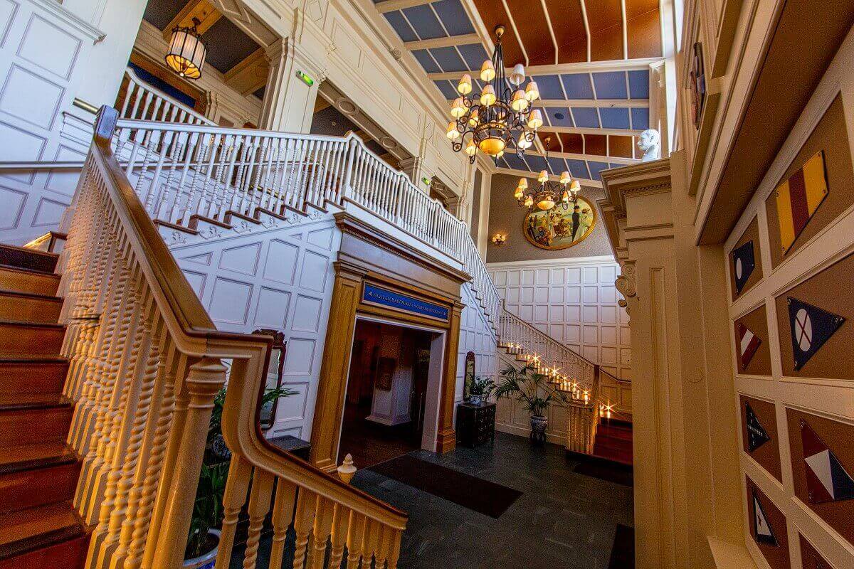 Hotel Newport Bay Club In a stairwell of the Newport Bay Club hotel, there are shipping symbols on the wall and a chandelier on the ceiling.