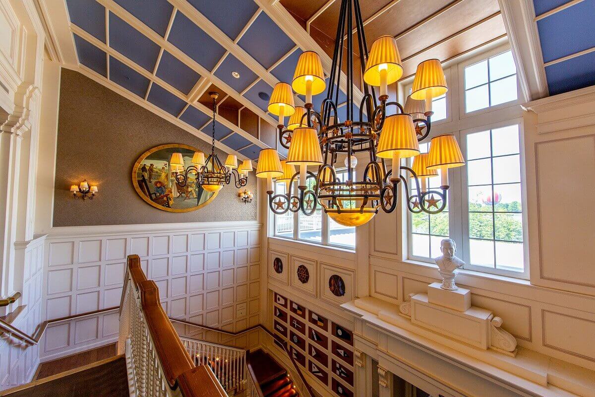 Staircase Hotel Newport Bay Club Two chandeliers are mounted on the blue-painted ceiling of a staircase at the Newport Bay Club hotel.