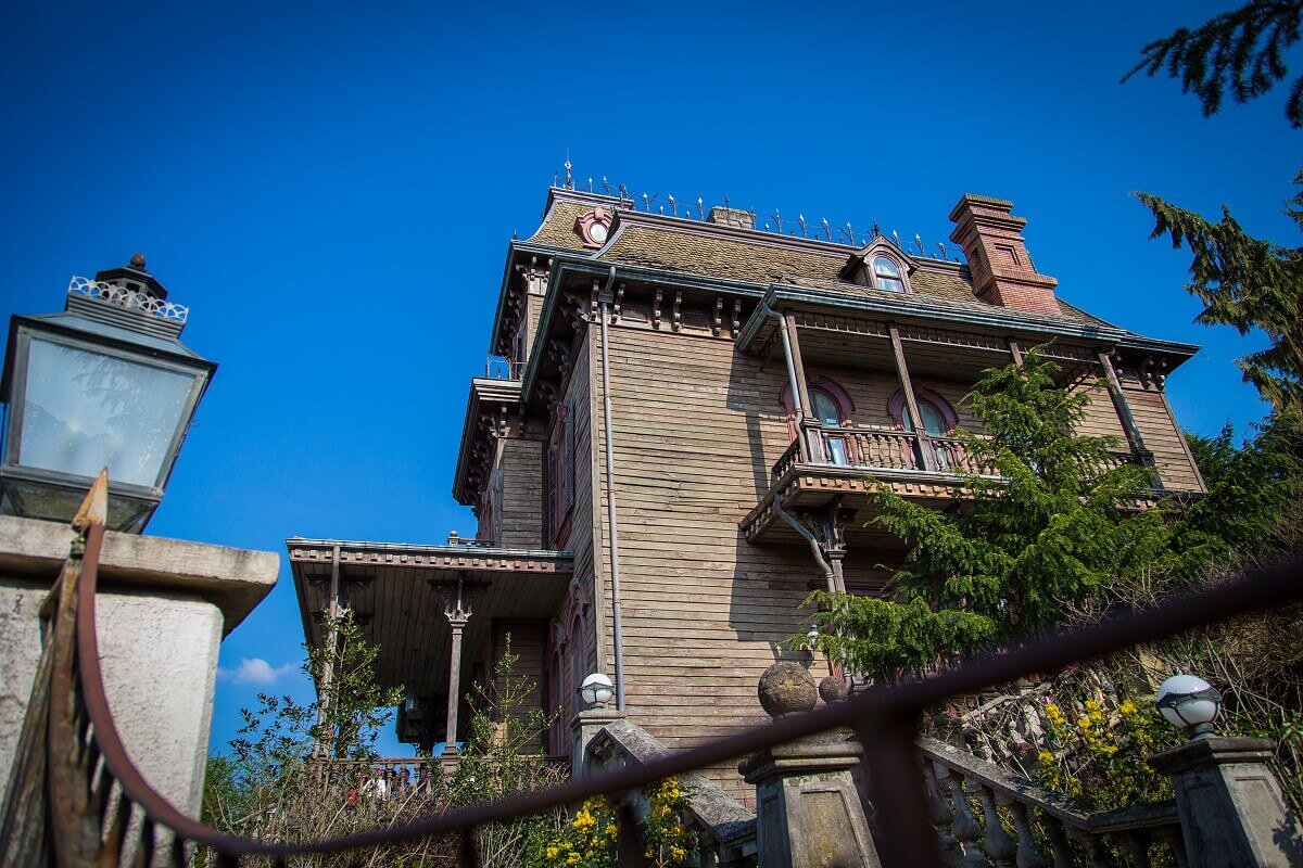 Phantom Manor Side view Side view of Phantom Manor with fence and lamp in the front