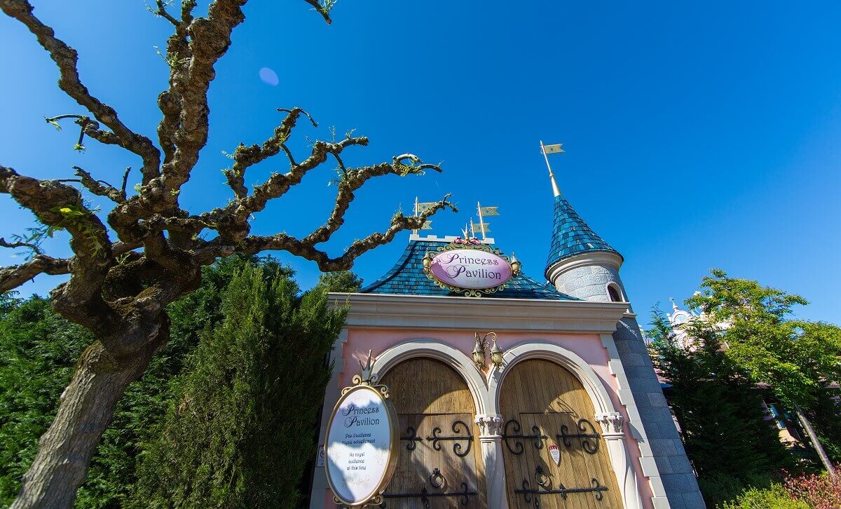 The Princess Pavilion View of the entrance to the princess pavilion and a gnarled tree standing to the left of it in Fantasyland