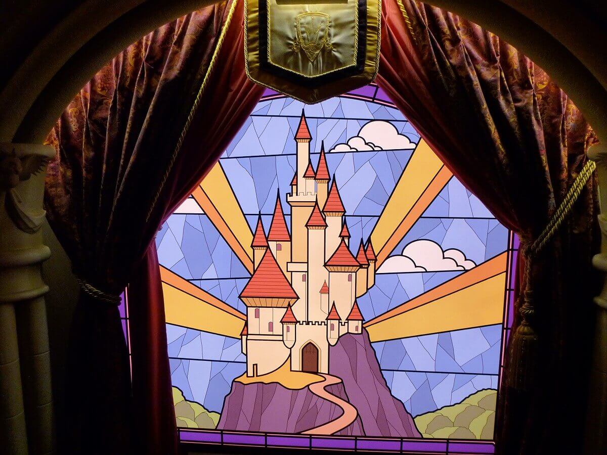 Stained glass window to Snow White's castle A stained glass window in the Princess Pavilion features an image of Snow White's fairytale castle