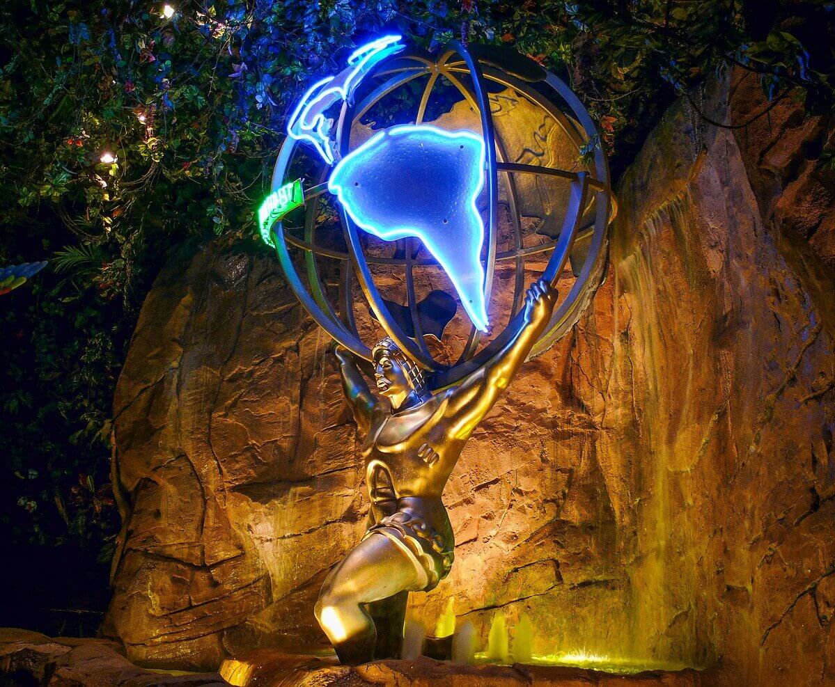 Atlas holds the earth A statue of Atlas holding the globe. Atlas is standing in a fountain in the restaurant, behind him is a rock wall with waterfall