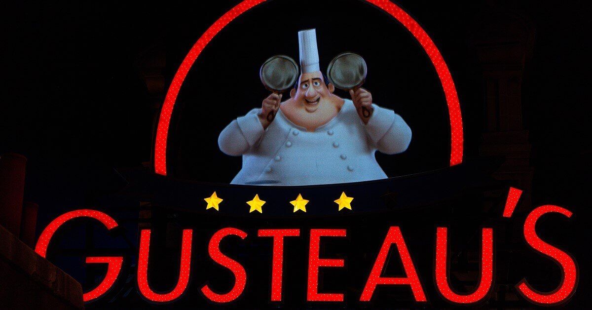 Ratatouile - the Adventure Billboard with Gusteau shaping Mickey ears with pans in the waiting area of Ratatouile - the Adventure