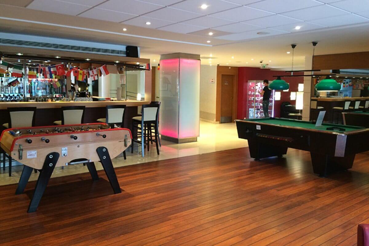 Lounge In the hotel lounge, directly behind the bar, there is a foosball table and a billiards table