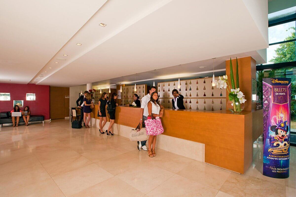 Residhome Reception Reception in the hotel Residhome with three counters where guests are checking in at the moment