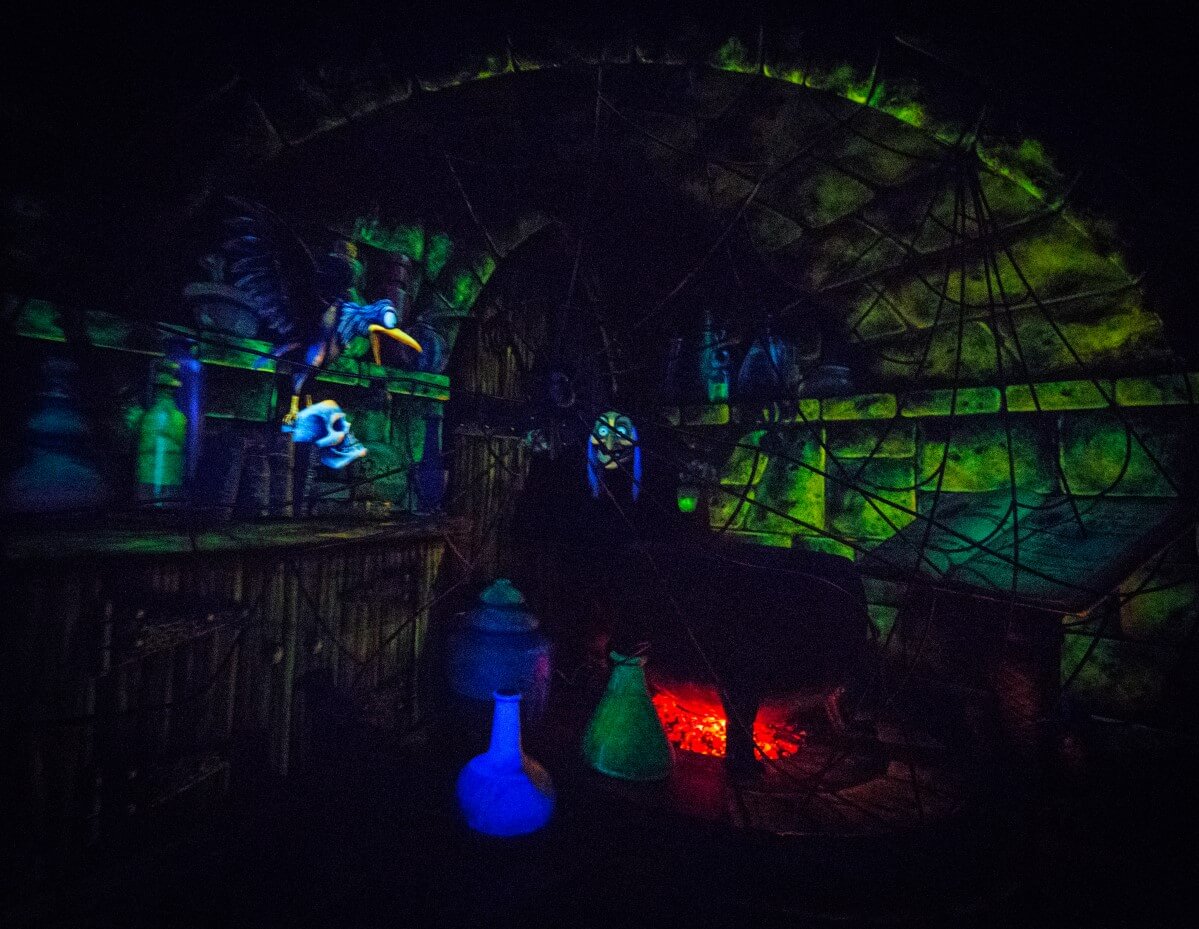 Dungeon of the Evil Queen behind a thick spider's web in the dungeon the Evil Queen can be seen transformed as an old woman