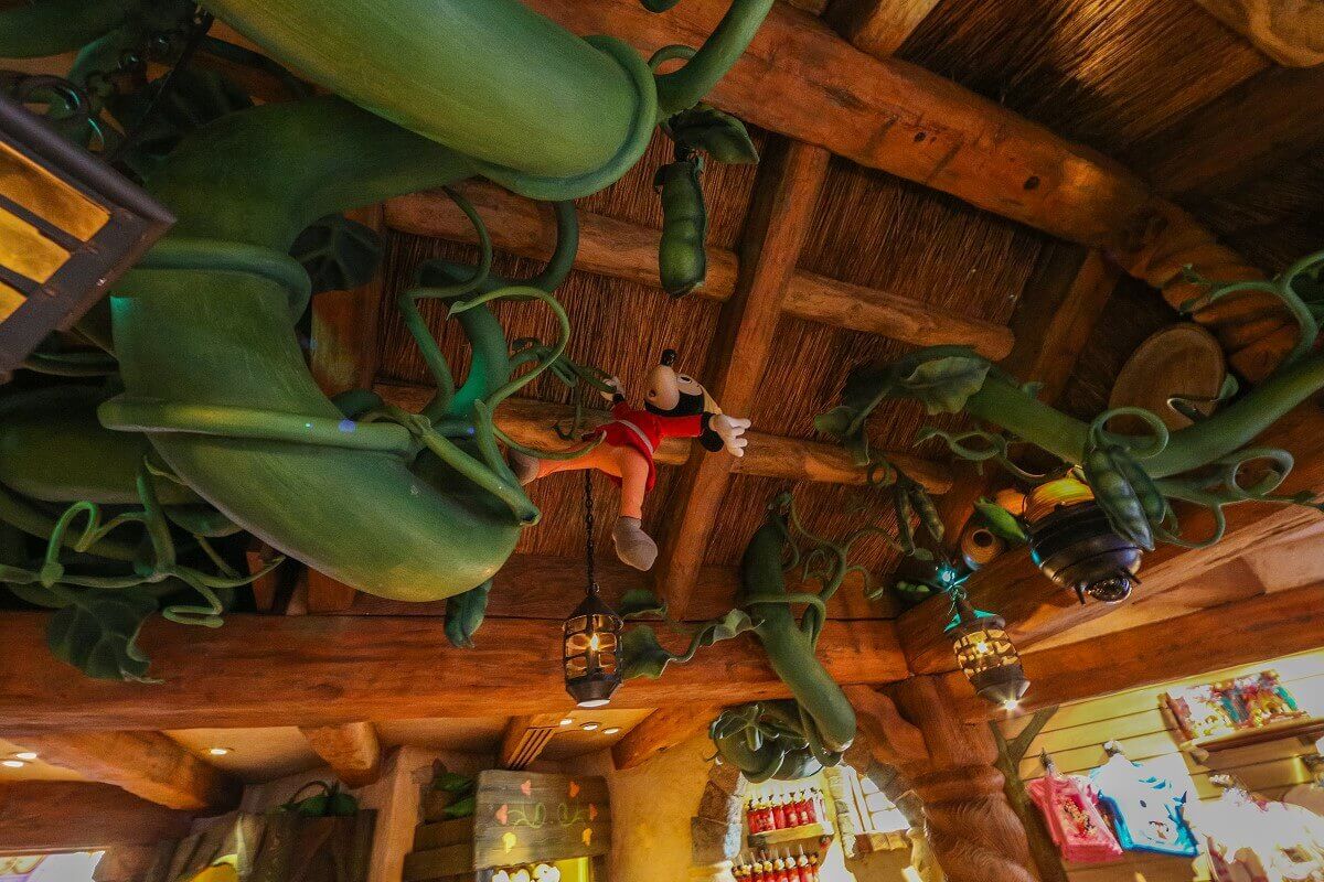 Mickey on the beanstalk A figurine of Mickey hangs from the beanstalk inside Sir Mickey's boutique