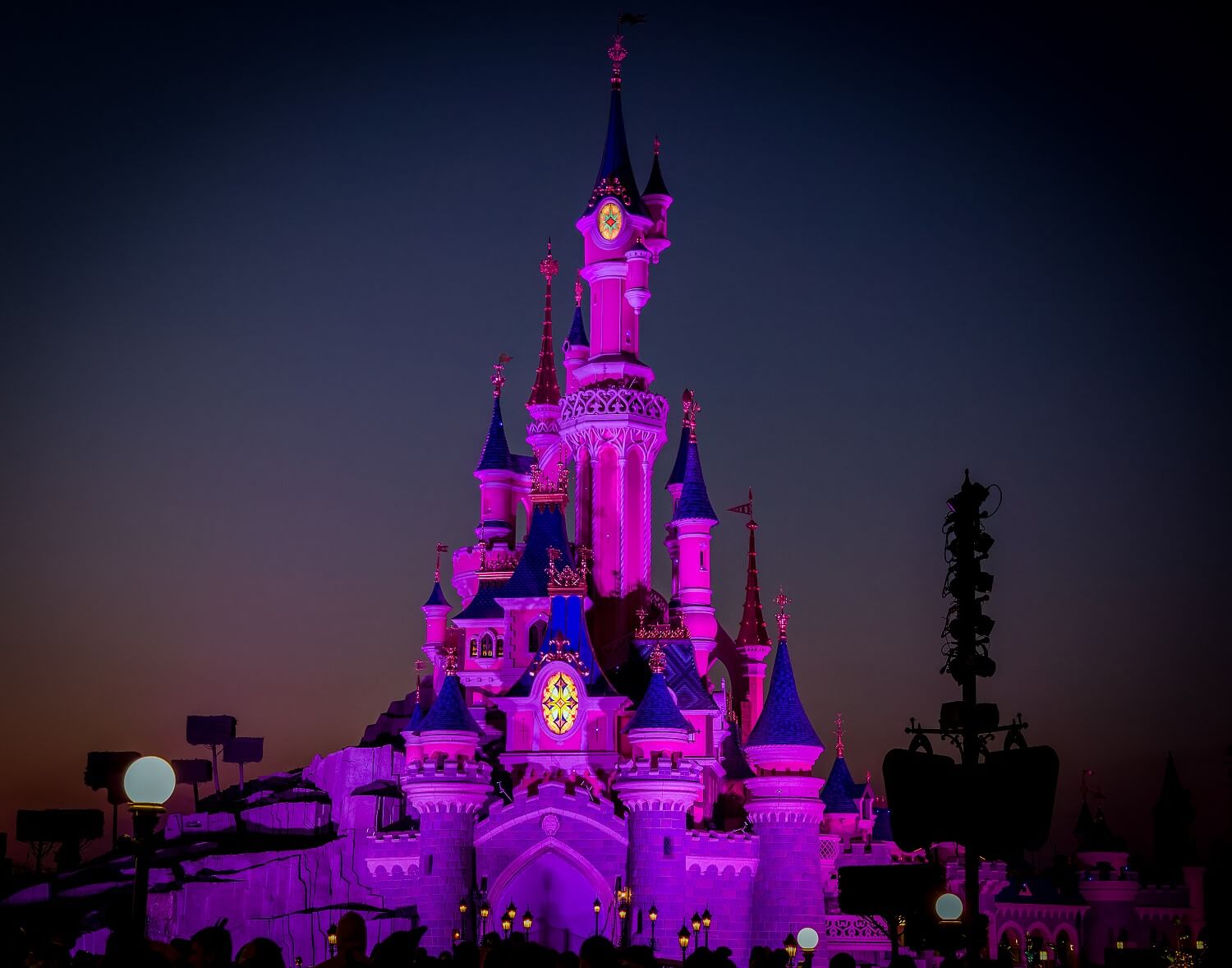 The Sleeping Beauty Castle just before Illuminations The Sleeping Beauty Castle just before Illuminations at dusk. It is illuminated purple