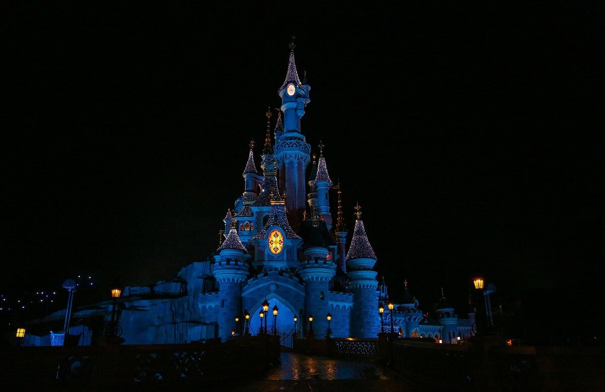 Evening atmosphere at the castle of Dornroeschen the castle of Sleeping Beauty shines through different illuminations at night