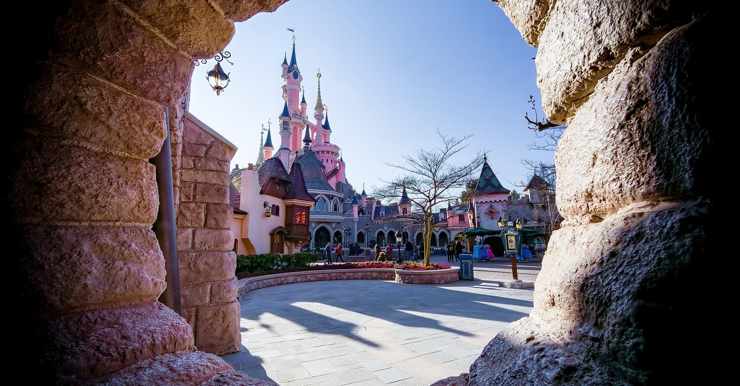 View of the castle through a hole in the wall View across the castle courtyard to the castle through a hole in the wall
