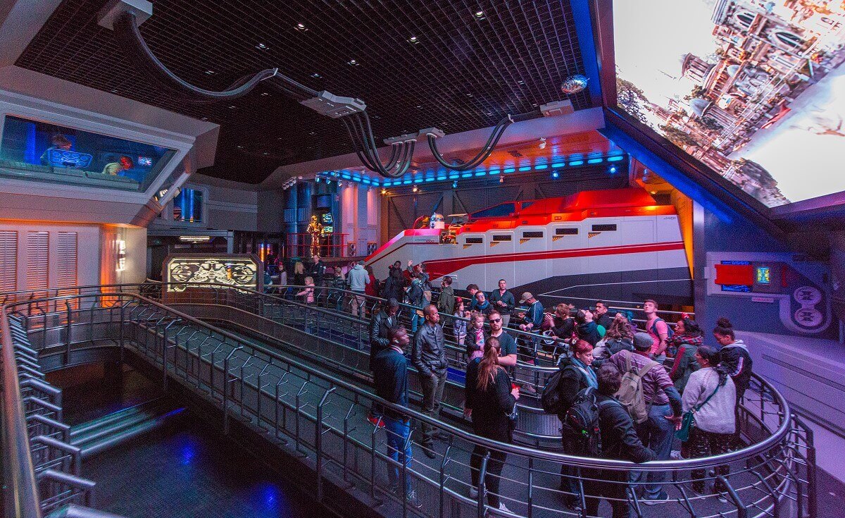 Queue area at Star Tours View of a queue area with a galactic transporter in white and orange
