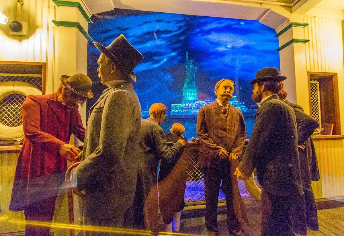 Six men and a child watch the ceremony Six men and a child watch the Statue of Liberty dedication ceremony