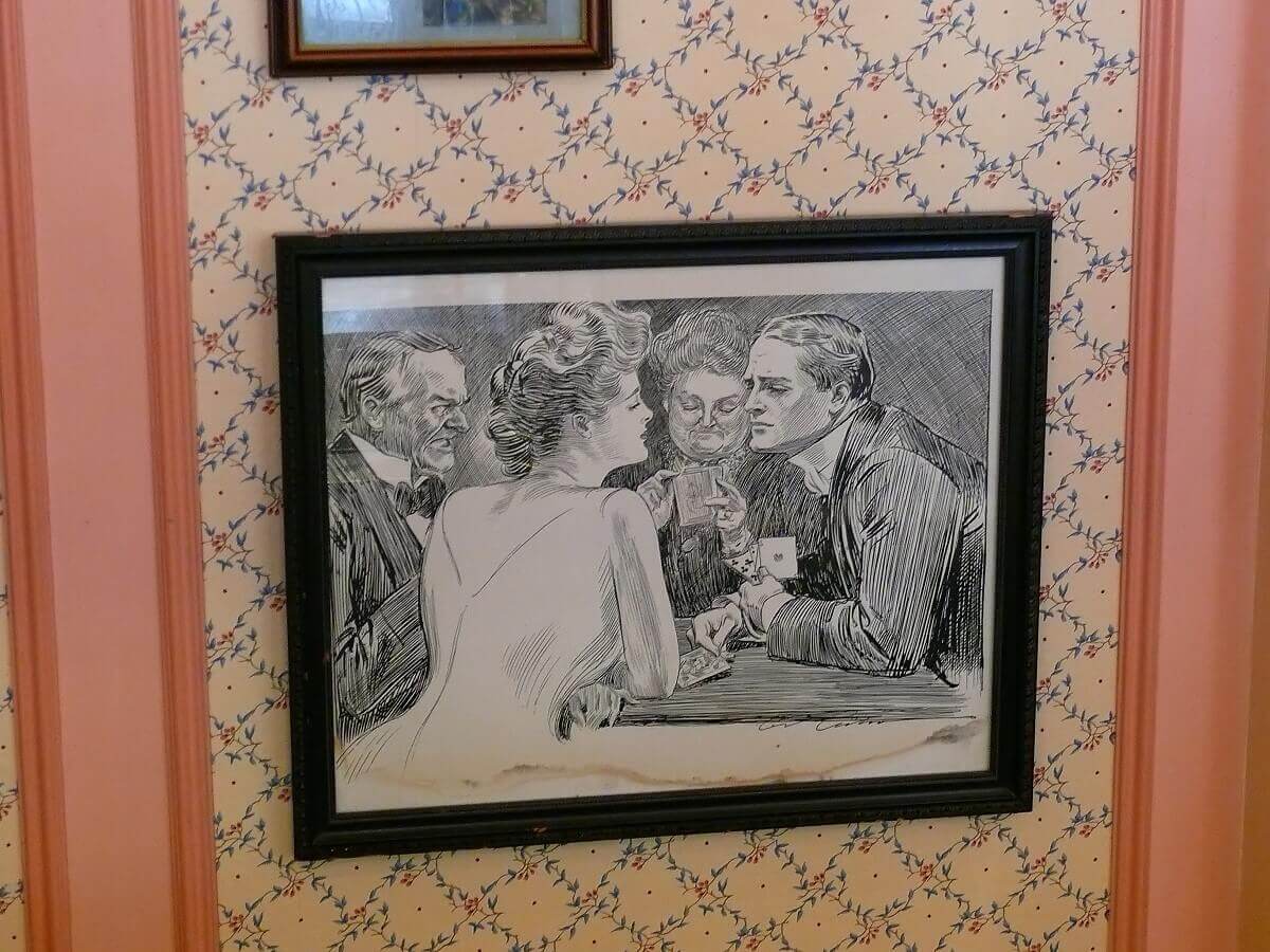 Charcoal drawing with two men and two women Charcoal drawing with two men and two women playing cards. The young man and the young woman flirting